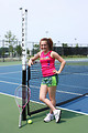Free Stock Photo: A cute young girl playing tennis.