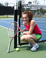 Free Stock Photo: A cute young girl playing tennis