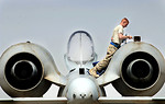 Free Stock Photo: A soldier insecting an airplane