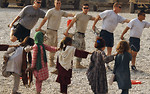 Free Stock Photo: Soldiers and children in Afghanistan stretching before playing soccer