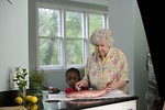 Free Stock Photo: An elderly woman preparing fresh fish