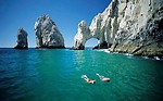 Free Stock Photo: Man and woman snorkeling by cliffs and rocks