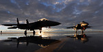 Free Stock Photo: Two F-15E fighter jets on a runway at sunset