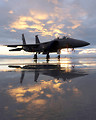 Free Stock Photo: An F-15E fighter jet on a runway at sunset