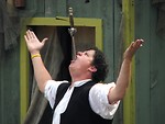 Free Stock Photo: Sword swallower with a sword in his mouth