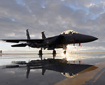 Free Stock Photo: An F-15E fighter jet on a runway at sunset