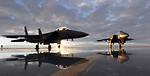 Free Stock Photo: Two F-15E fighter jets on a runway at sunset