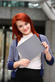 Free Stock Photo: A beautiful young woman holding a blank card
