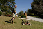 Free Stock Photo: A man mowing a lawn