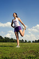 Free Stock Photo: A young woman stretching outdoors before exercising