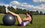 Free Stock Photo: A young woman stretching outdoors before exercising