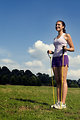 Free Stock Photo: A young woman stretching outdoors before exercising