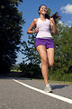 Free Stock Photo: A young woman jogging outdoors