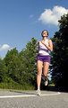 Free Stock Photo: A young woman jogging outdoors