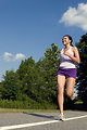 Free Stock Photo: A young woman jogging outdoors