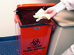 Free Stock Photo: A lab technician discarding disposable gloves