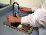 Free Stock Photo: A lab technician washing her hands