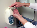 Free Stock Photo: A lab technician putting soap on her hand