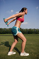 Free Stock Photo: A healthy young woman warming up for exercise outdoors