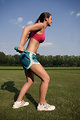 Free Stock Photo: A healthy young woman warming up for exercise outdoors