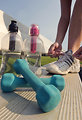 Free Stock Photo: A healthy young woman tying her laces before exercise