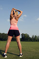 Free Stock Photo: A healthy young woman stretching before exercise outdoors
