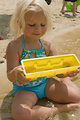 Free Stock Photo: A young girl playing in the water at a beach