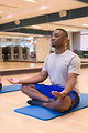 Free Stock Photo: A man practicing yoga in a fitness center