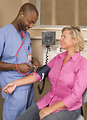 Free Stock Photo: A male nurse taking a woman