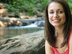 Free Stock Photo: Teen girl sitting on rock by river