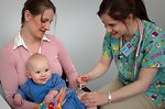 Free Stock Photo: An infant receiving a vaccination shot from his doctor