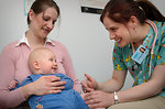 Free Stock Photo: An infant receiving a vaccination shot from his doctor