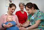 Free Stock Photo: An infant receiving a vaccination shot from his doctor