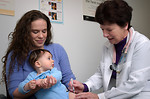 Free Stock Photo: An infant receiving a vaccination shot from his doctor