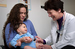 Free Stock Photo: An infant receiving a vaccination shot from his doctor
