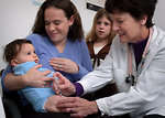 Free Stock Photo: An infant receiving a vaccination shot from his doctor