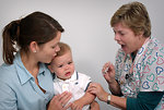 Free Stock Photo: An infant receiving a vaccination shot from his doctor