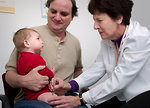 Free Stock Photo: An infant receiving a vaccination shot from his doctor