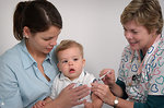 Free Stock Photo: An infant receiving a vaccination shot from his doctor