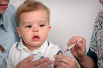 Free Stock Photo: An infant receiving a vaccination shot from his doctor
