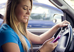 Free Stock Photo: A teen girl texting while driving