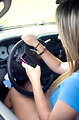 Free Stock Photo: A teen girl texting while driving