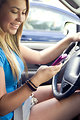 Free Stock Photo: A teen girl texting while driving
