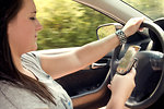 Free Stock Photo: A teen girl texting while driving