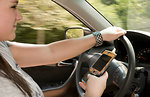 Free Stock Photo: A teen girl texting while driving