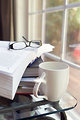 Free Stock Photo: A cup of coffee with a stack of books