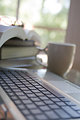 Free Stock Photo: A laptop keyboard with coffee