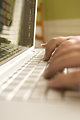 Free Stock Photo: Female hands typing on a laptop keyboard