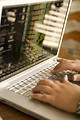 Free Stock Photo: Female hands typing on a laptop keyboard