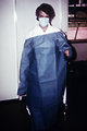 Free Stock Photo: A doctor putting on a gown